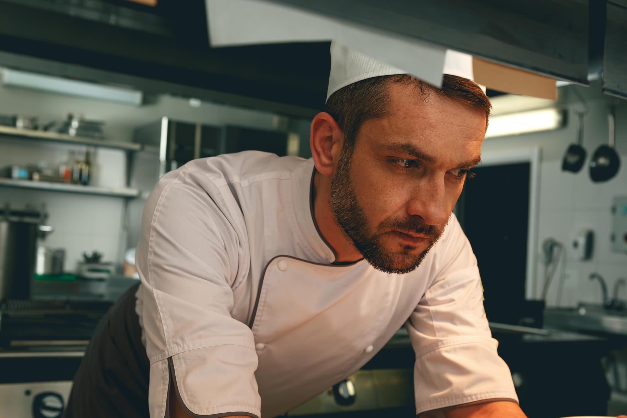 Head chef portrait in neutral kitchen
